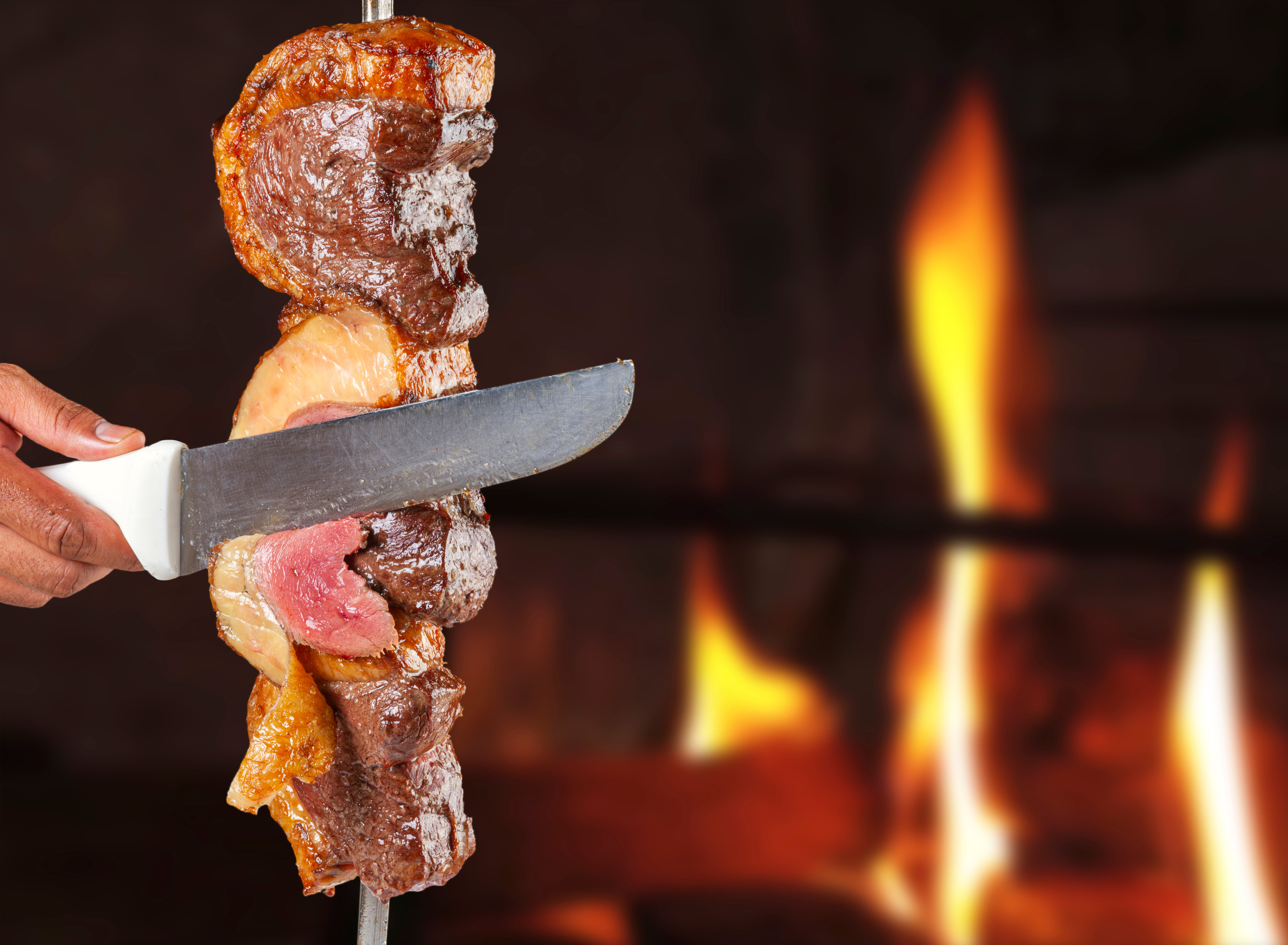 Steak rotisserie at the steakhouse, sliced picanha, Picanha