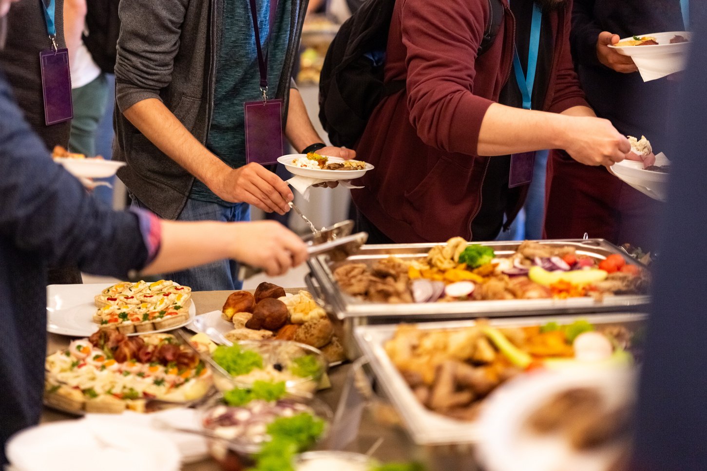 People enjoying buffet meal.